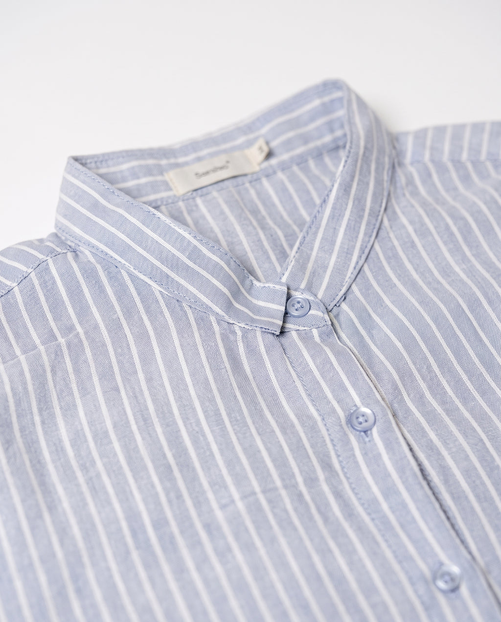 Longline striped shirt — Fabric texture and collar detail | Generated by Modelize