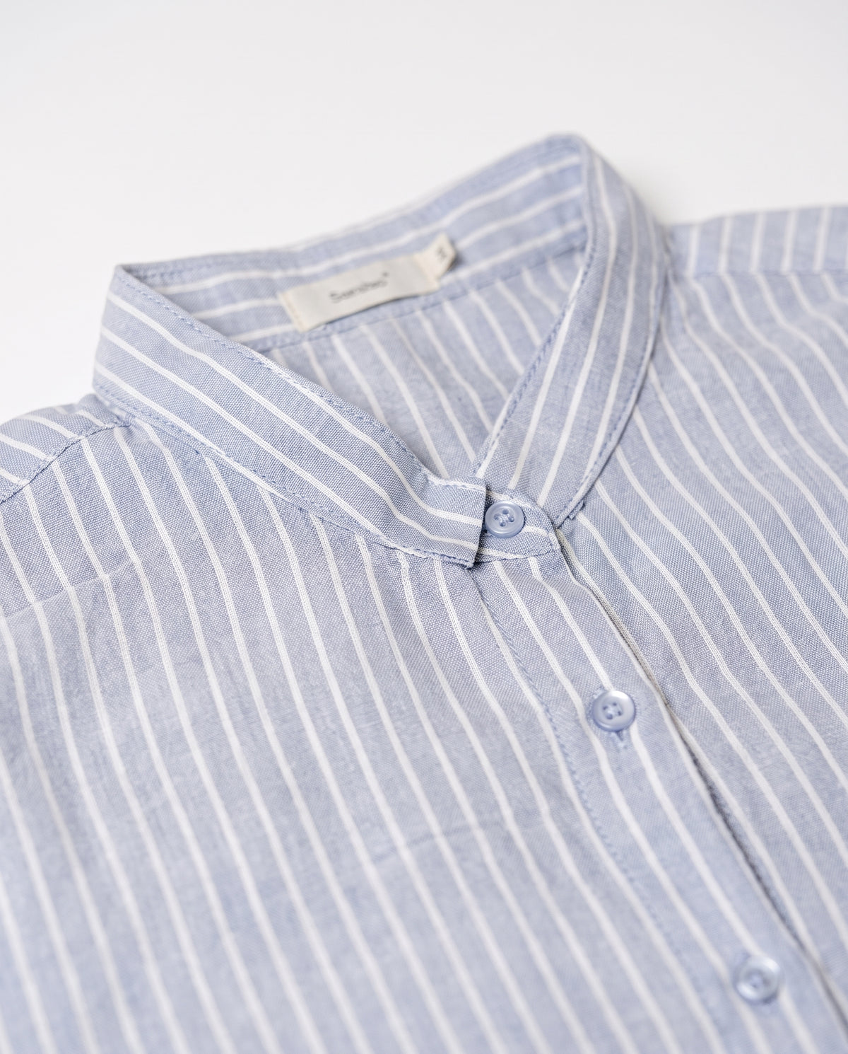 Longline striped shirt — Fabric texture and collar detail | Generated by Modelize