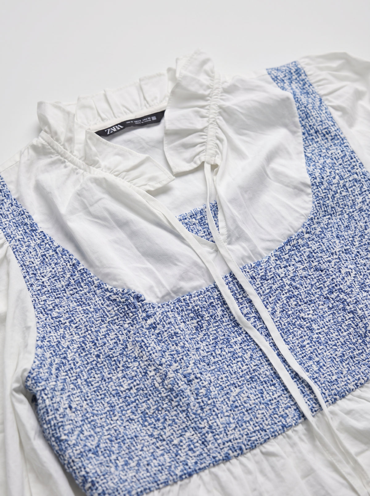 Two-piece blouse and trousers ensemble — Textile & Design Detail | Generated by Modelize